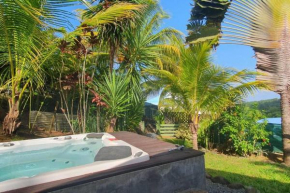 Cottage créole dans jardin tropical